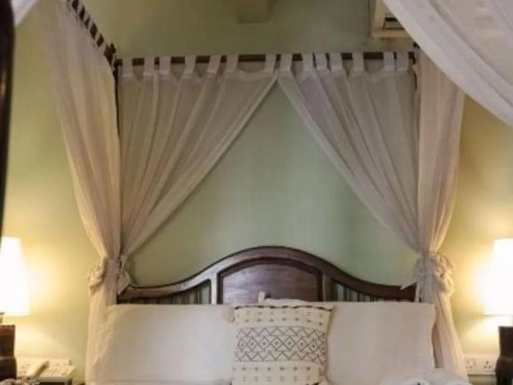 Bed in Anggun Boutique Hotel