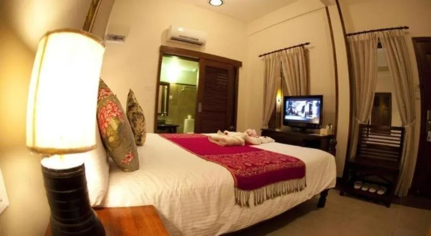 Bed in Anggun Boutique Hotel