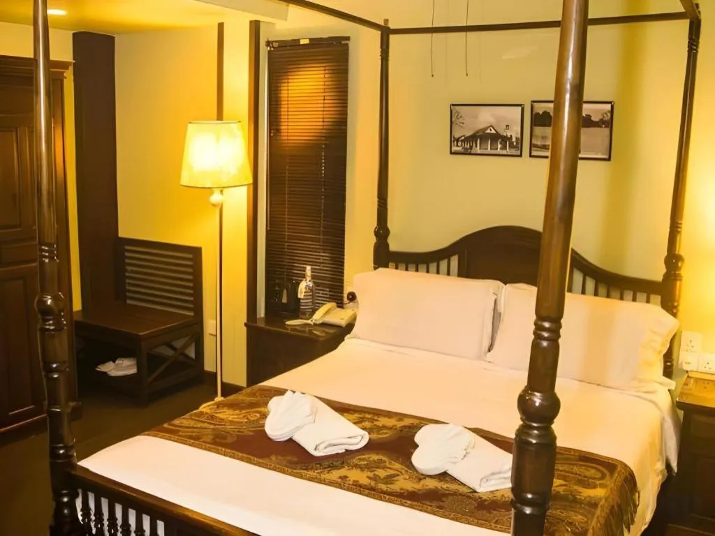 Bed in Anggun Boutique Hotel