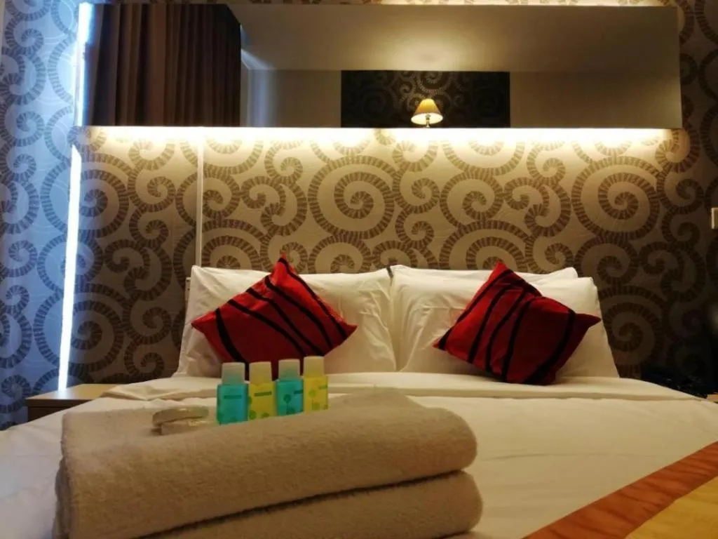 Bed in Paragon City Hotel