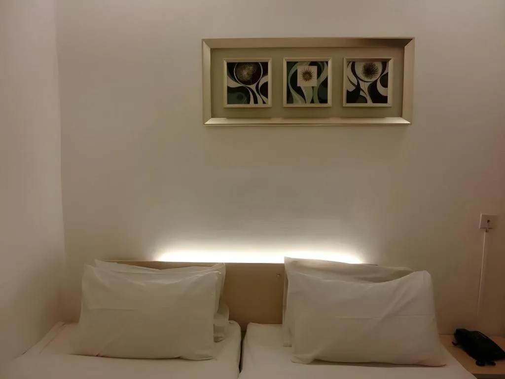 Bed in Paragon City Hotel