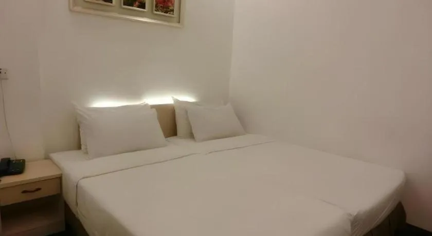 Bed in Paragon City Hotel