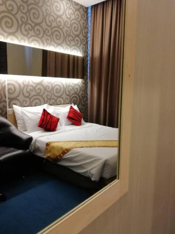 Bed in Paragon City Hotel