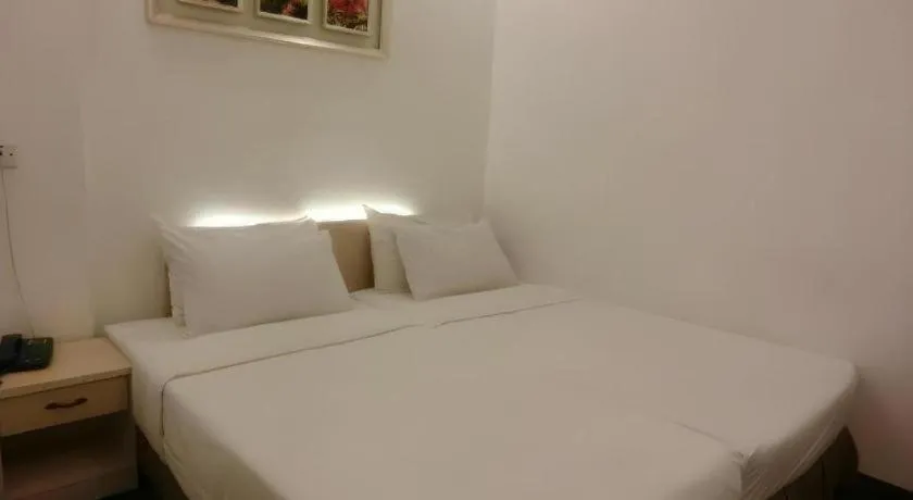 Bed in Paragon City Hotel