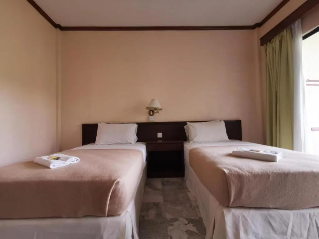 Bed in OYO 89972 Borneo Paradise Beach Hotel