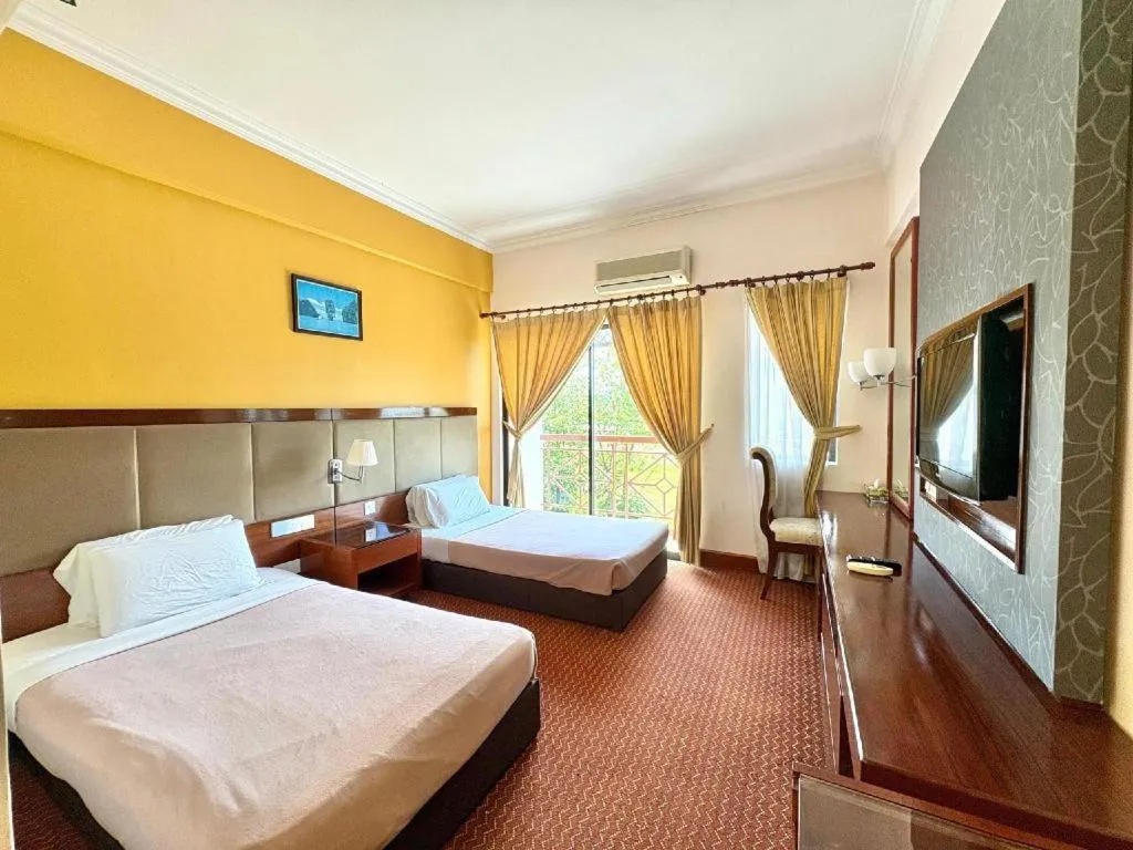 Bed in Putra Brasmana Hotel