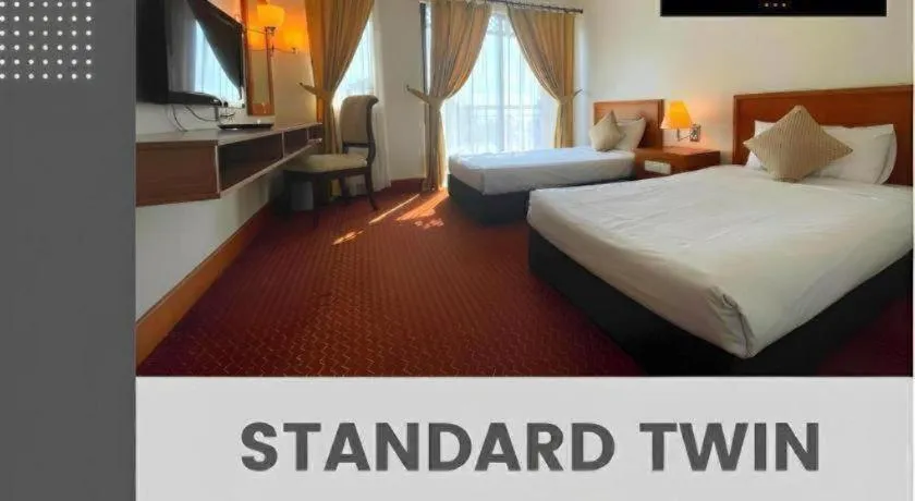 Bed in Putra Brasmana Hotel