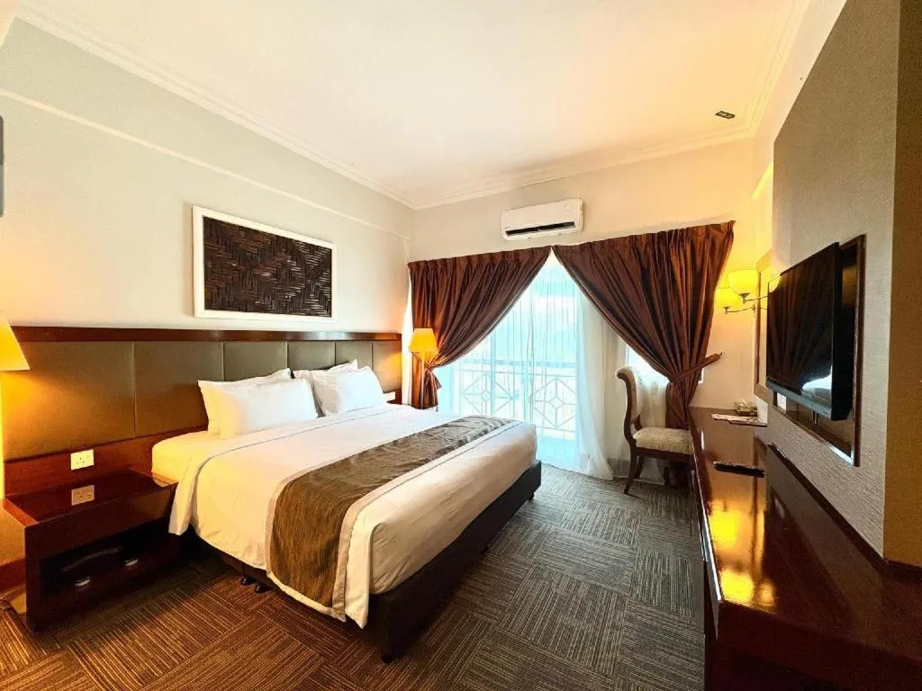 Bed in Putra Brasmana Hotel
