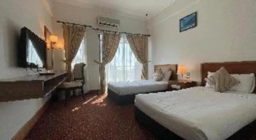 Bed in Putra Brasmana Hotel