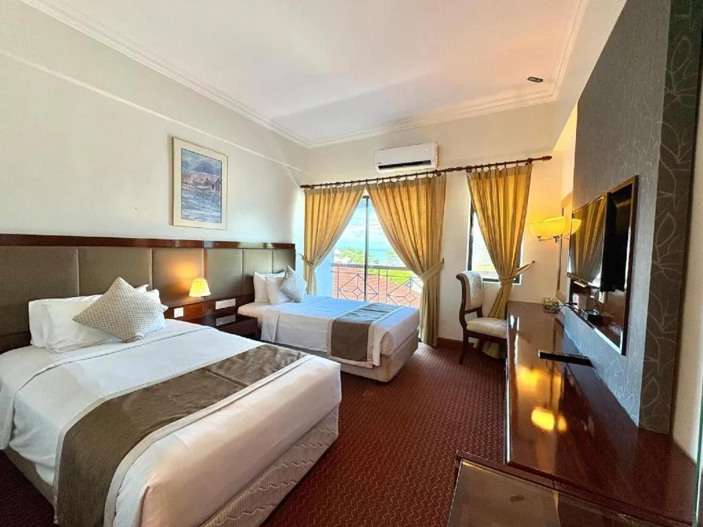 Bed in Putra Brasmana Hotel