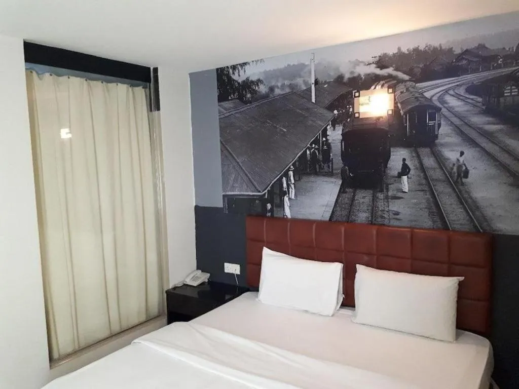 Bed in OYO 90865 Hotel De Nice Inn