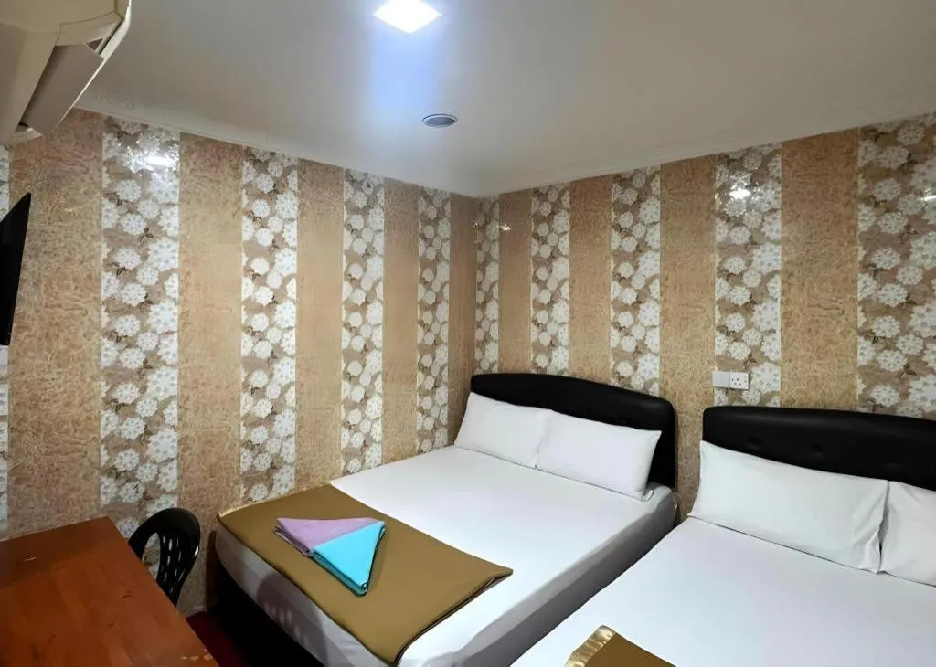 Bed in New Wave Hotel Melawati