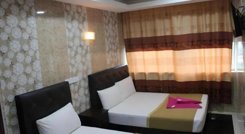 Bed in New Wave Hotel Melawati