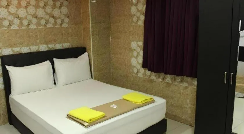 Bed in New Wave Hotel Melawati