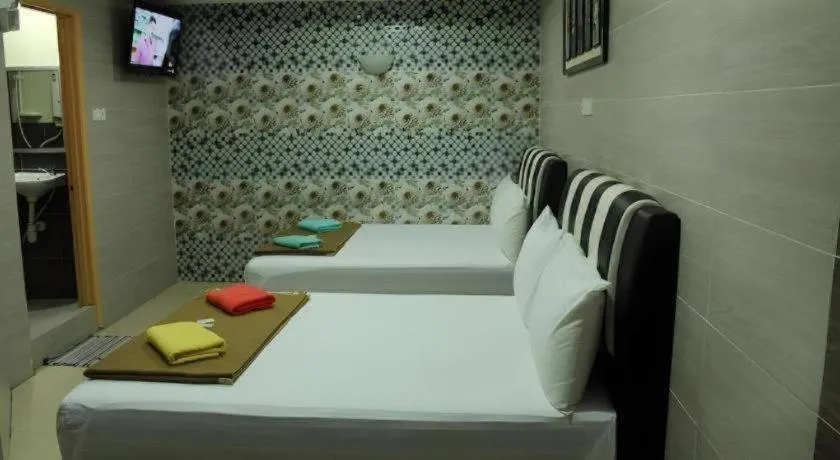 Bed in New Wave Hotel Melawati