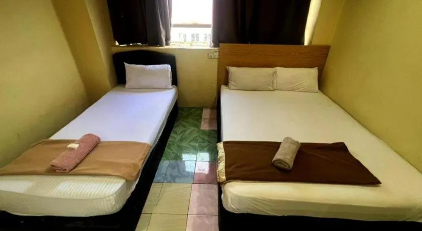 Bed in New Rawang Hotel