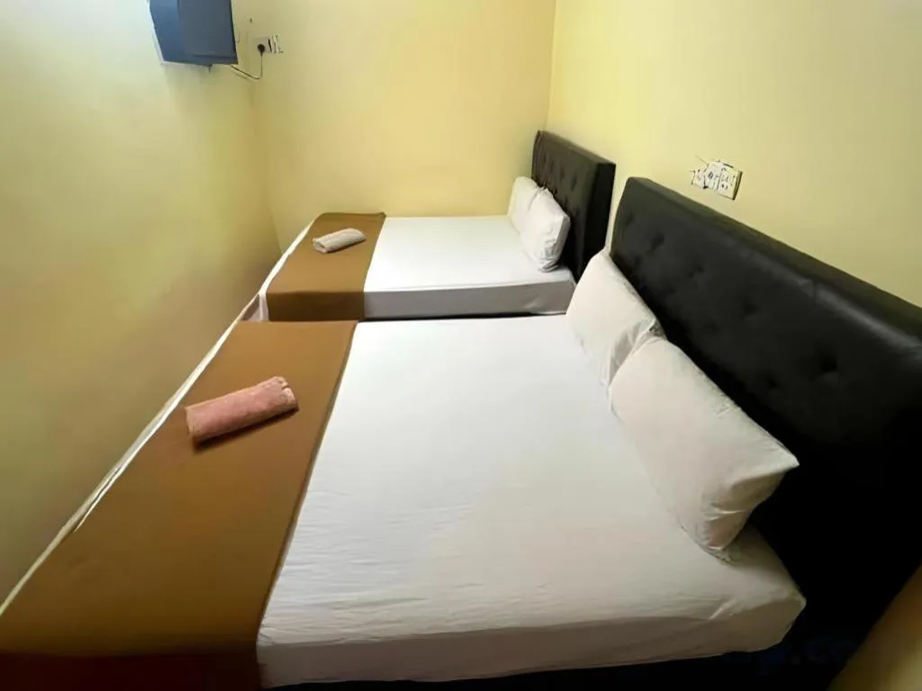 Bed in New Rawang Hotel