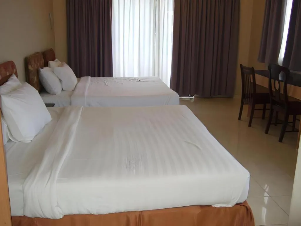 Bed in City Times Hotel