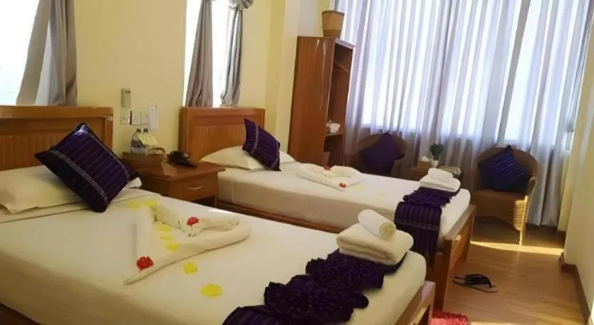 Bed in Goldenhill Hotel