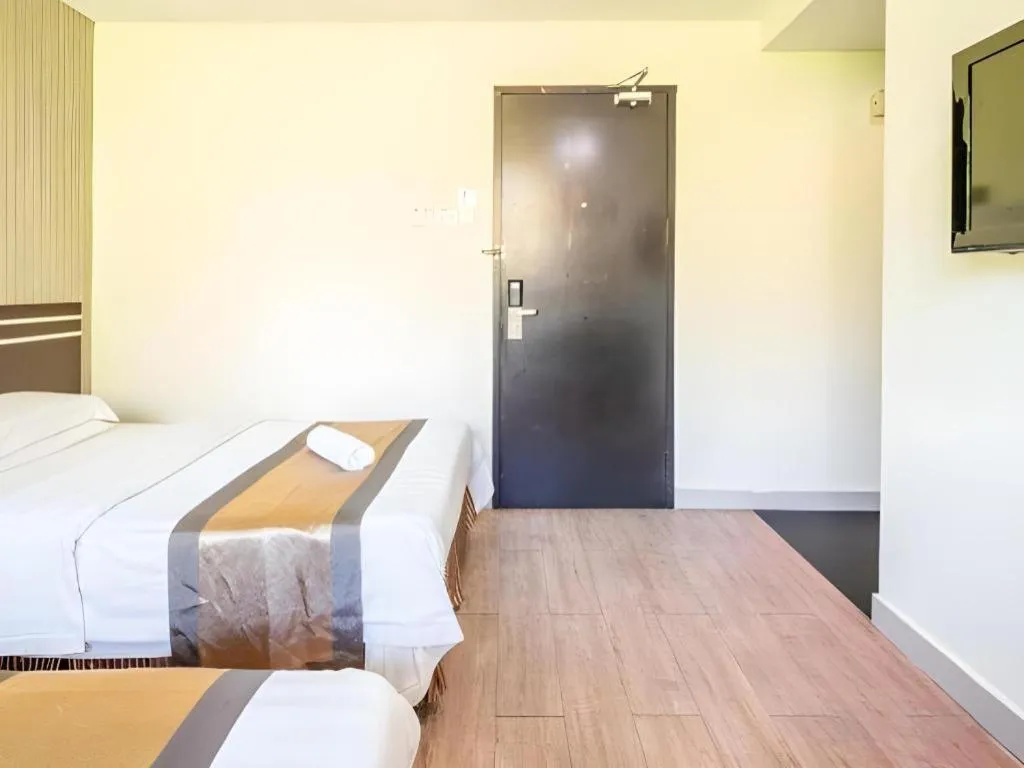 Bed in Goldenhill Hotel