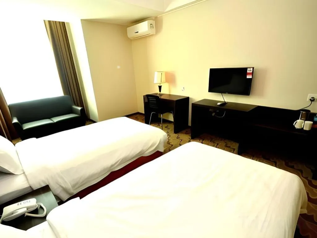 Bed in Eminent Hotel