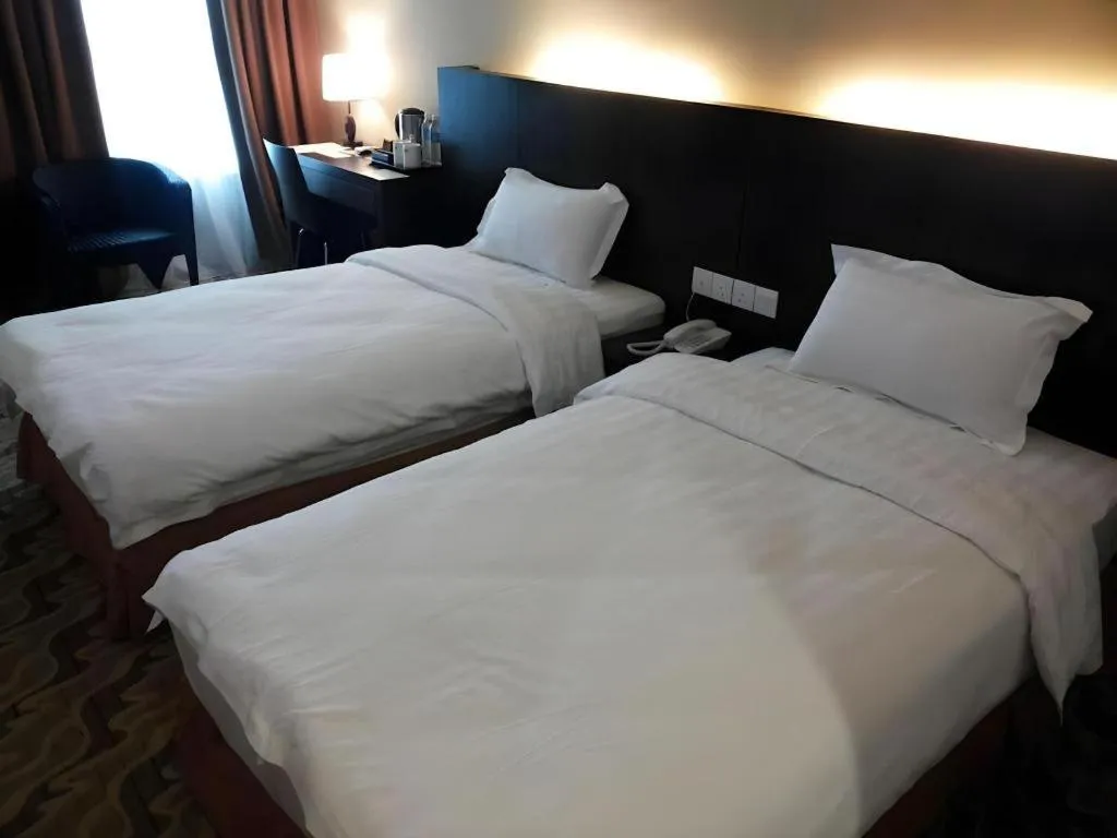 Bed in Eminent Hotel