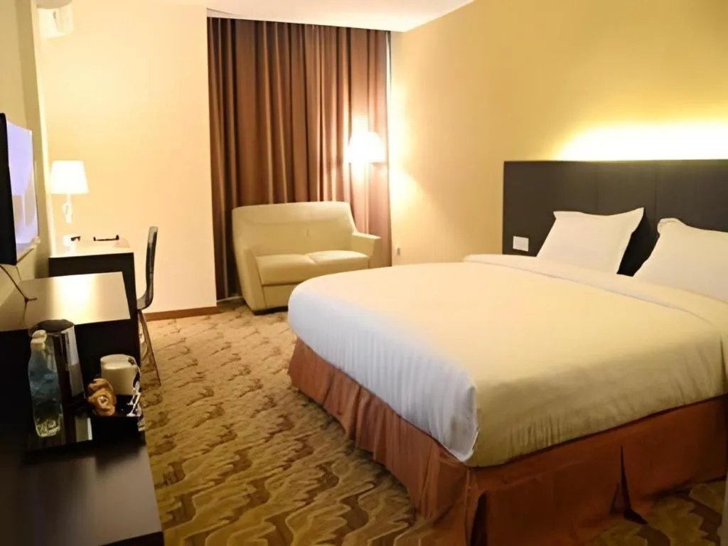 Bed in Eminent Hotel