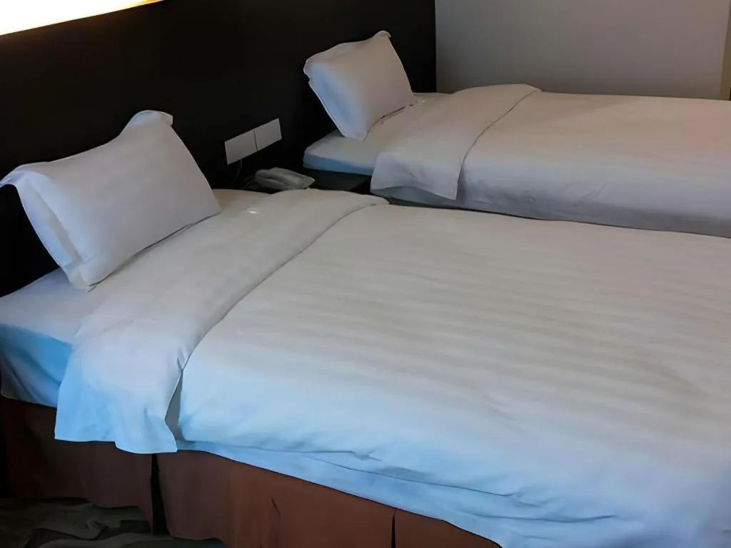 Bed in Eminent Hotel