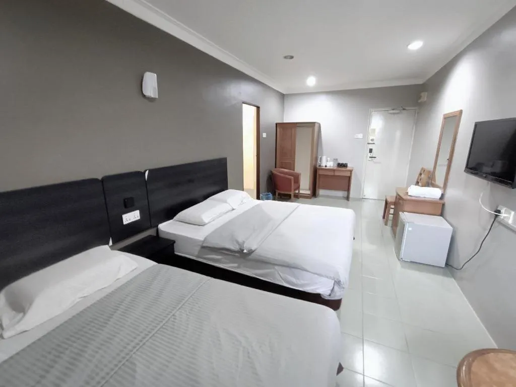 Bed in Sherrinton Hotel