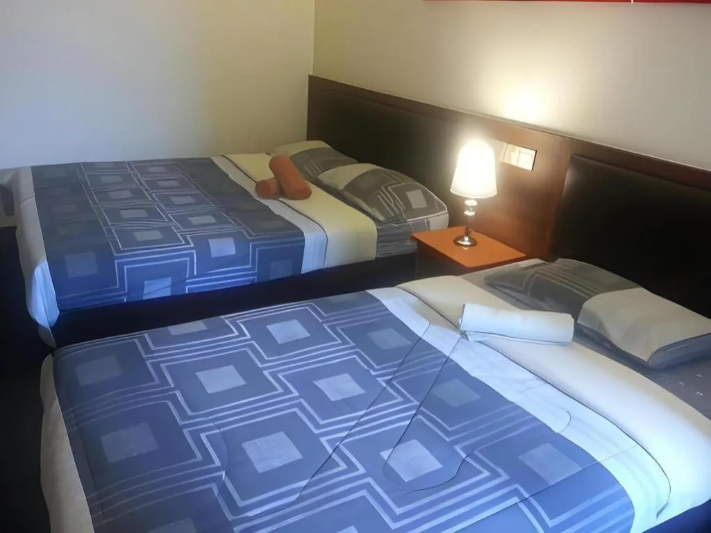 Bed in Camlodge Budget Hotel