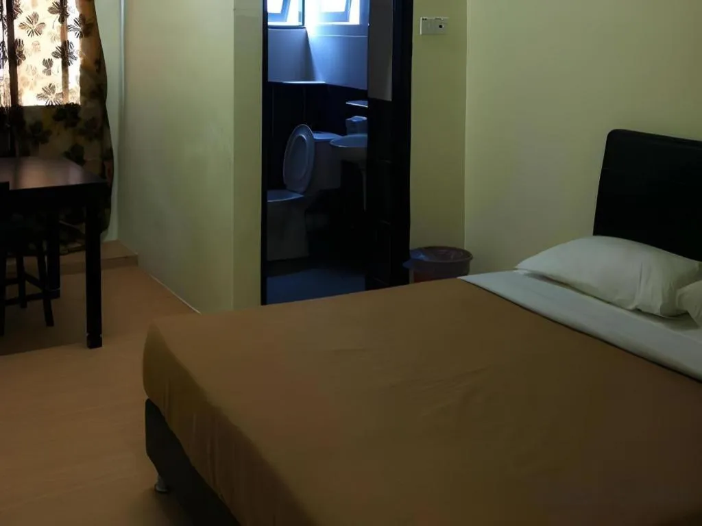 Bed in Camlodge Budget Hotel