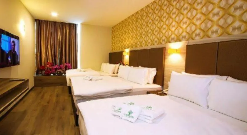 Bed in Tropicana Boutique Hotel