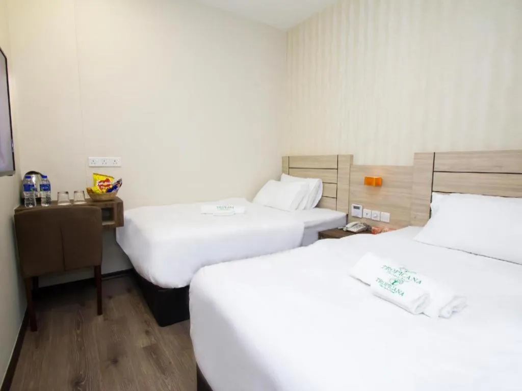 Bed in Tropicana Boutique Hotel