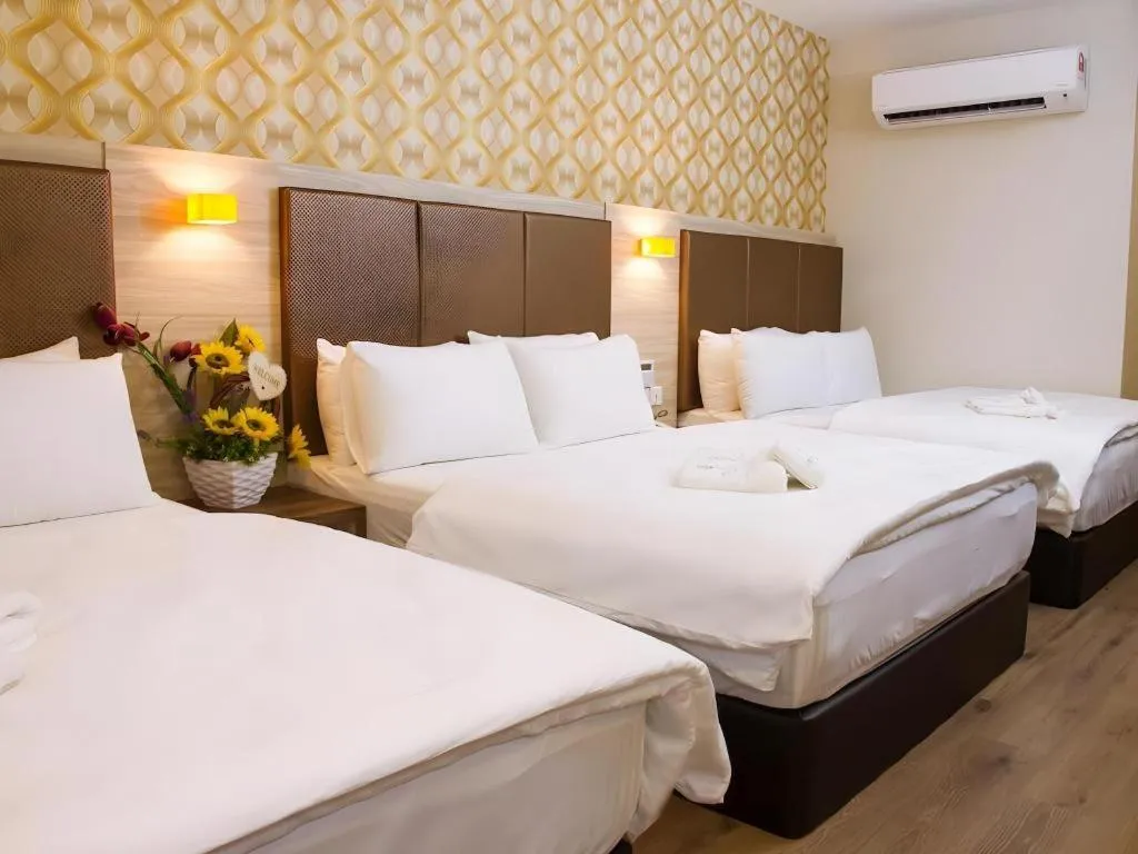 Bed in Tropicana Boutique Hotel