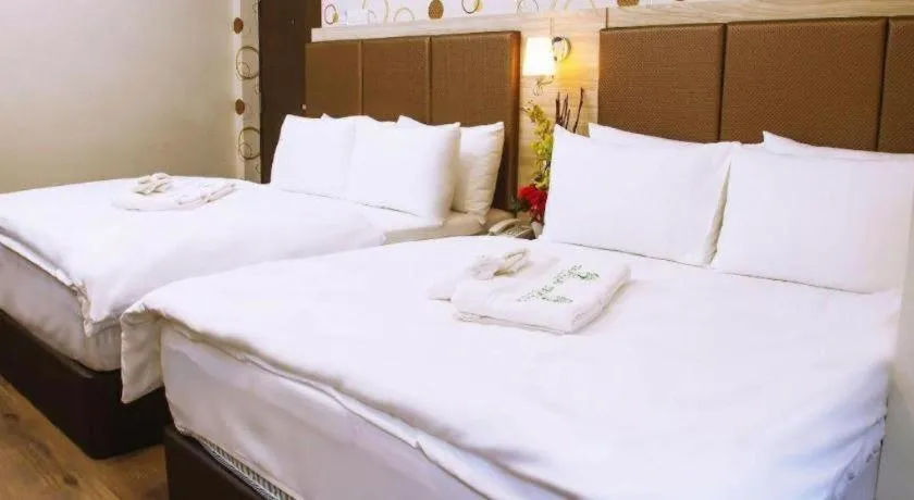 Bed in Tropicana Boutique Hotel