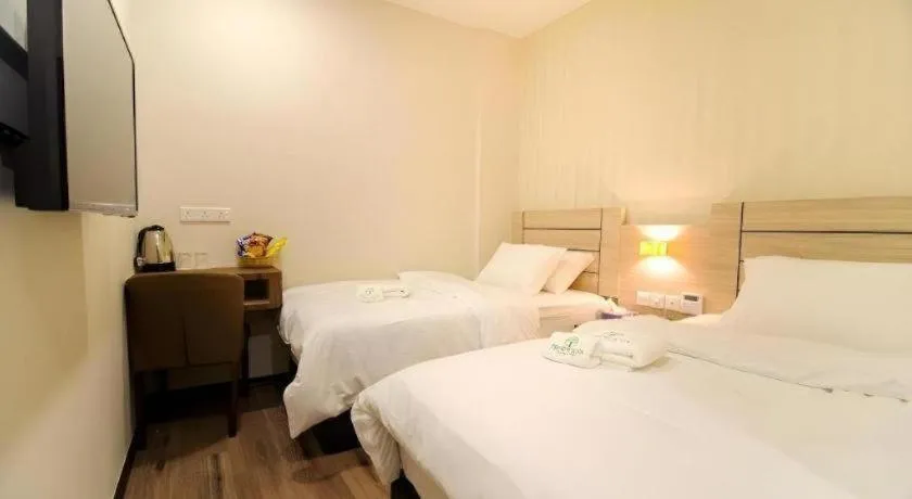 Bed in Tropicana Boutique Hotel