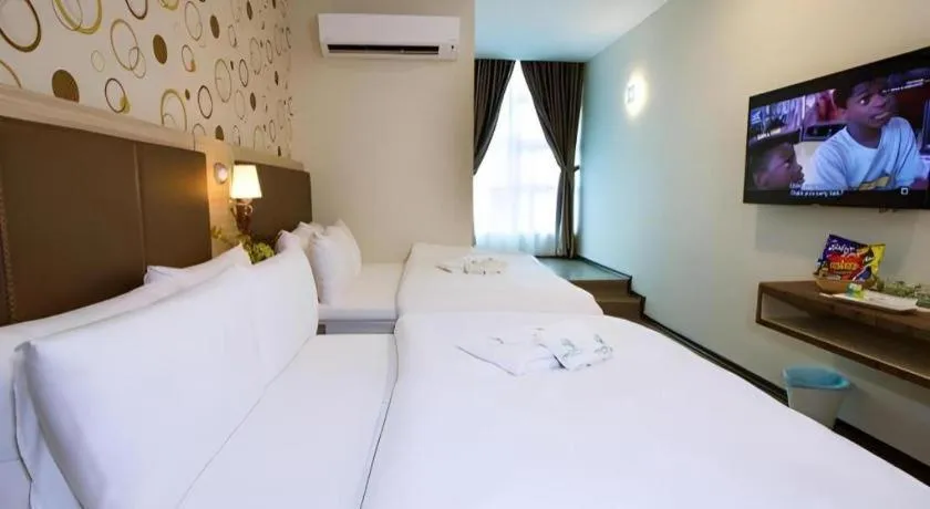 Bed in Tropicana Boutique Hotel