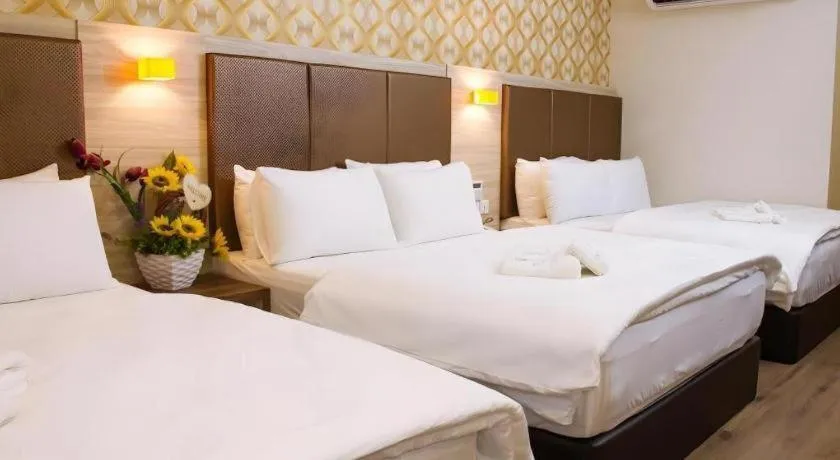 Bed in Tropicana Boutique Hotel