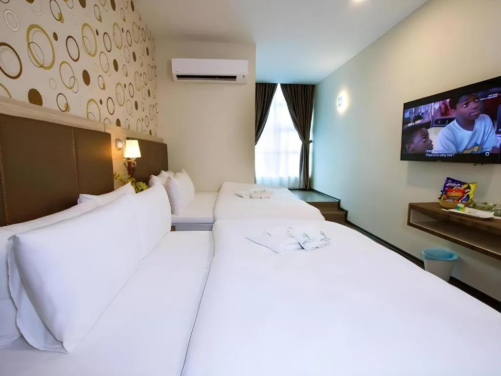 Bed in Tropicana Boutique Hotel