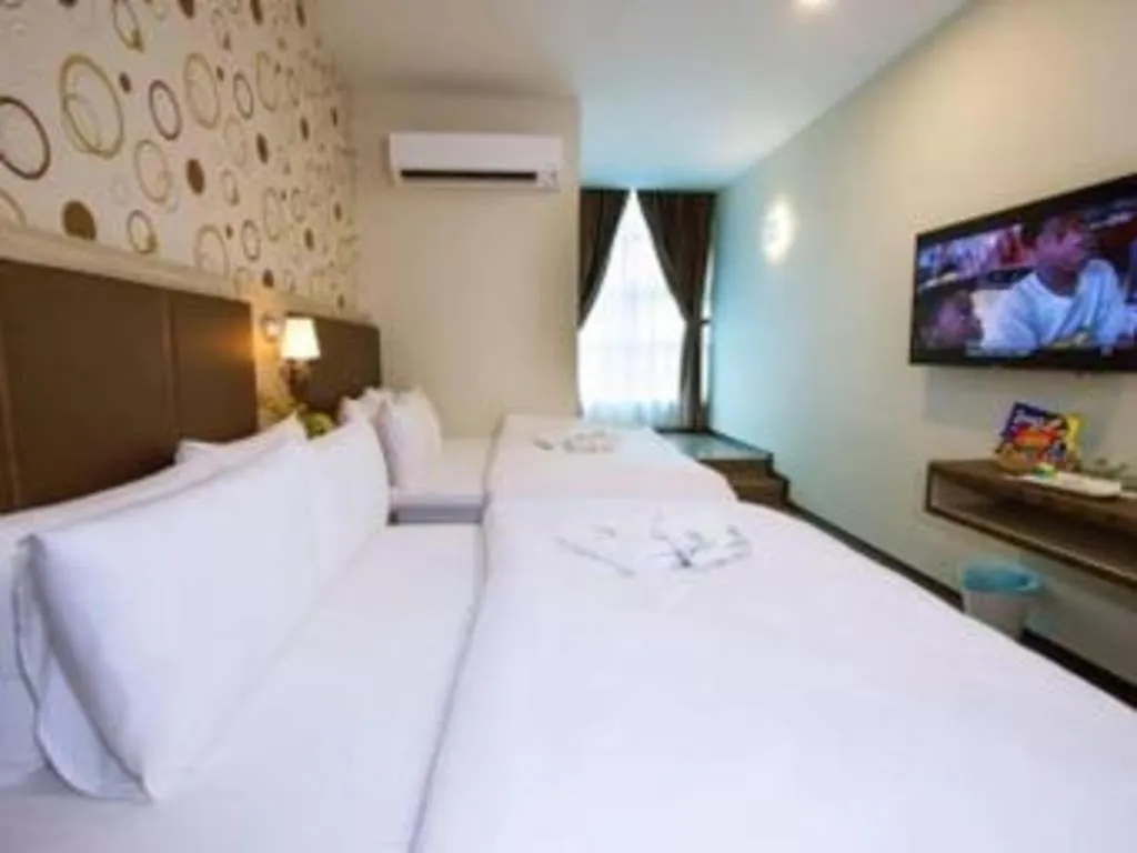 Bed in Tropicana Boutique Hotel