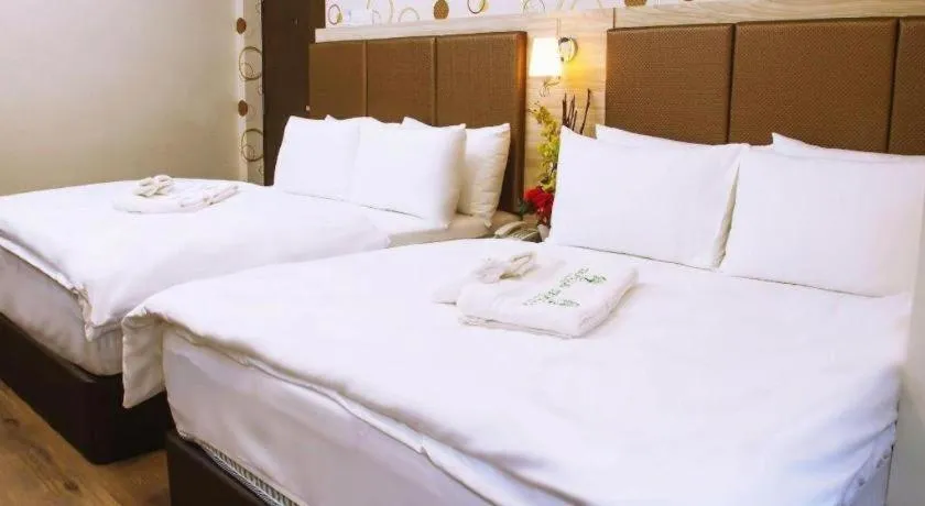 Bed in Tropicana Boutique Hotel