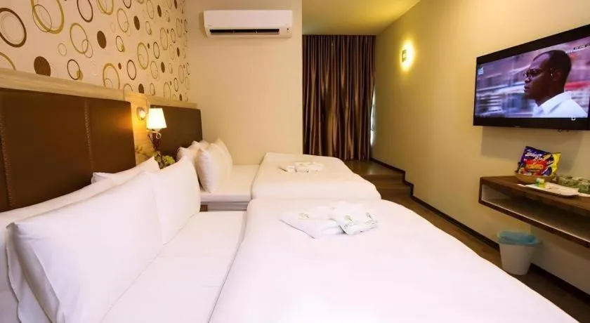 Bed in Tropicana Boutique Hotel