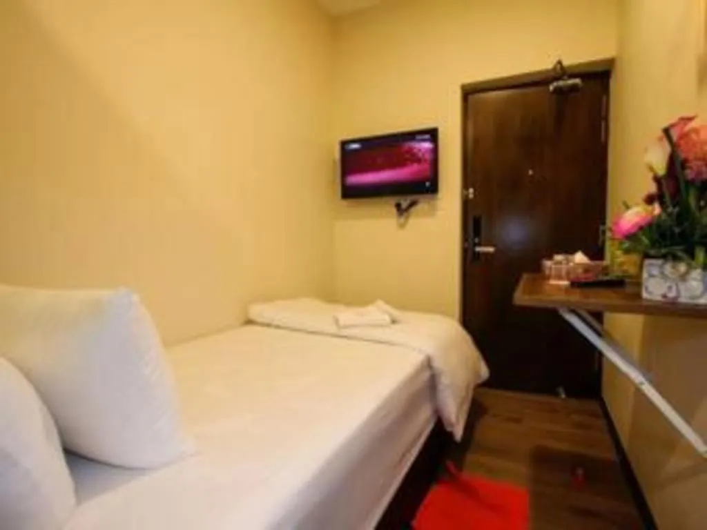 Bed in Tropicana Boutique Hotel