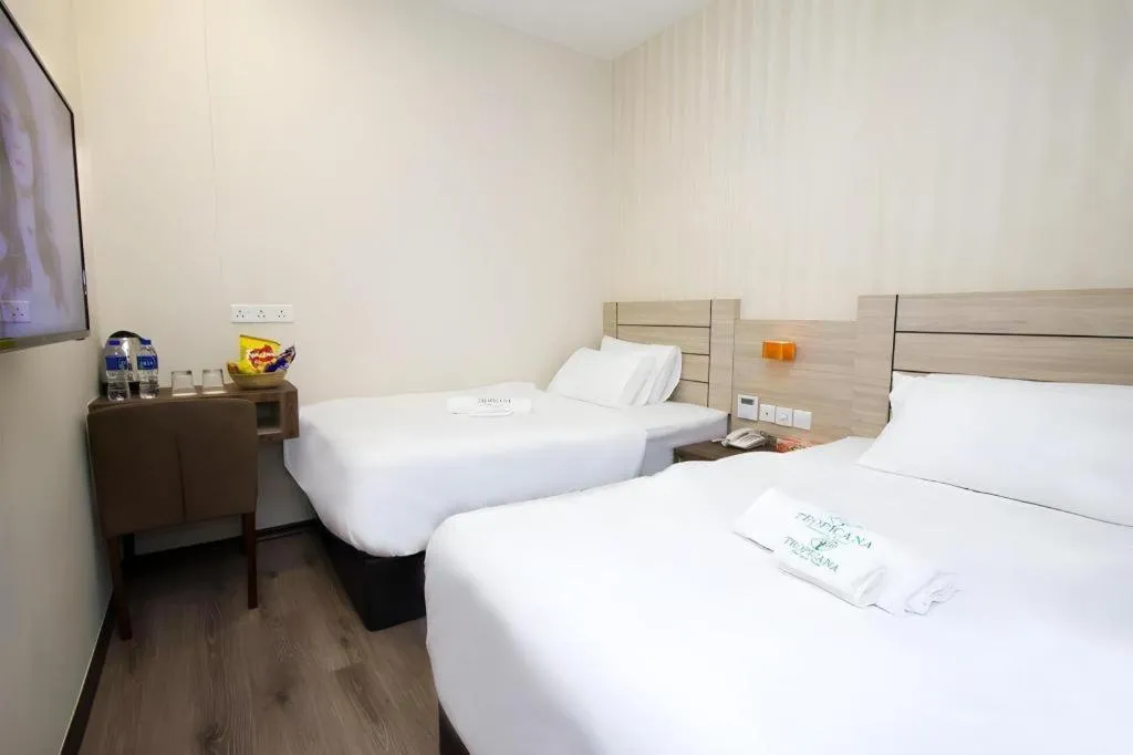 Bed in Tropicana Boutique Hotel