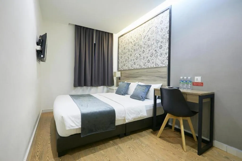 Bed in Le Ruiz Boutique Hotel