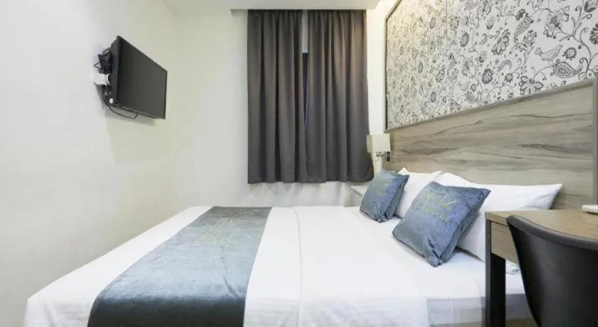 Bed in Le Ruiz Boutique Hotel