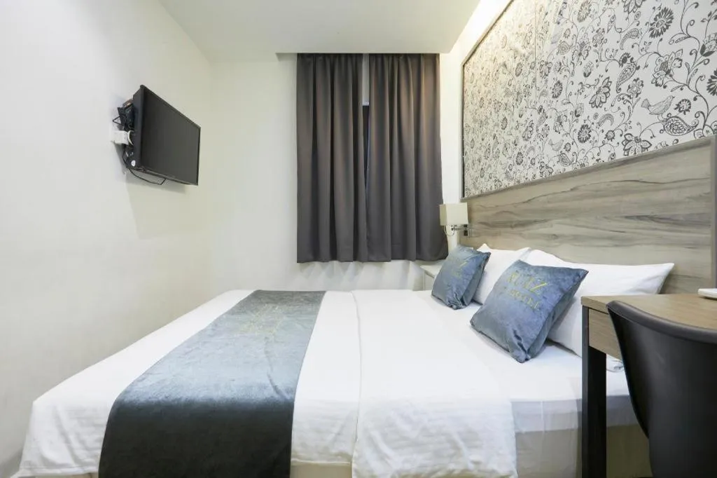 Bed in Le Ruiz Boutique Hotel