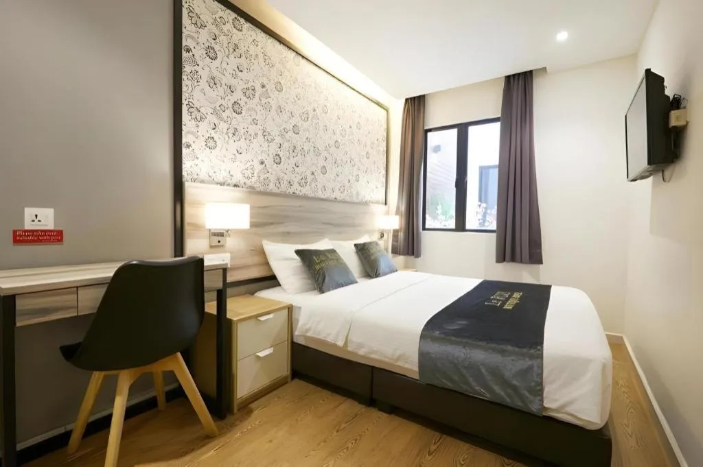 Bed in Le Ruiz Boutique Hotel