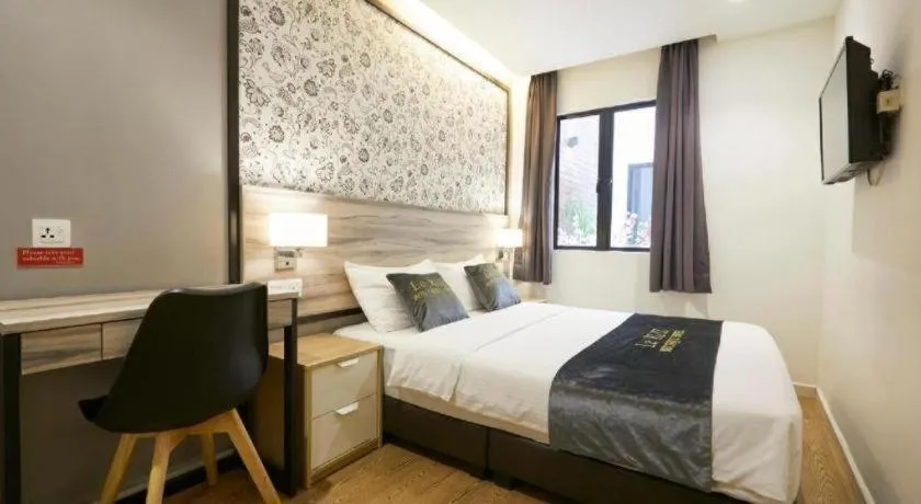 Bed in Le Ruiz Boutique Hotel