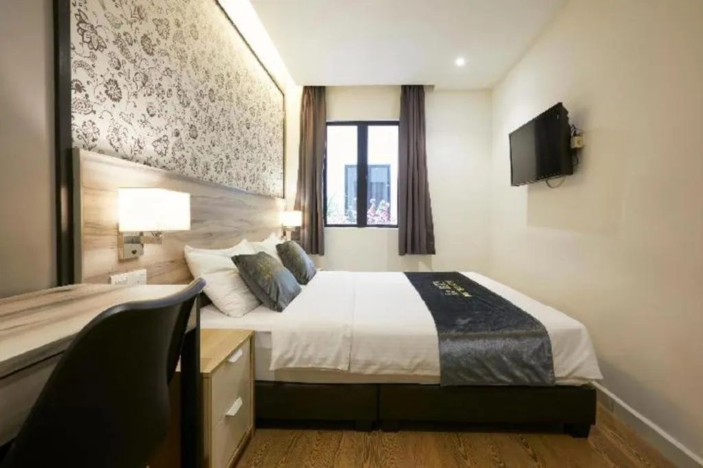 Bed in Le Ruiz Boutique Hotel